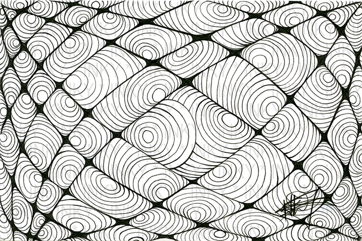 Black and white pattern of concentric circles on a textured background